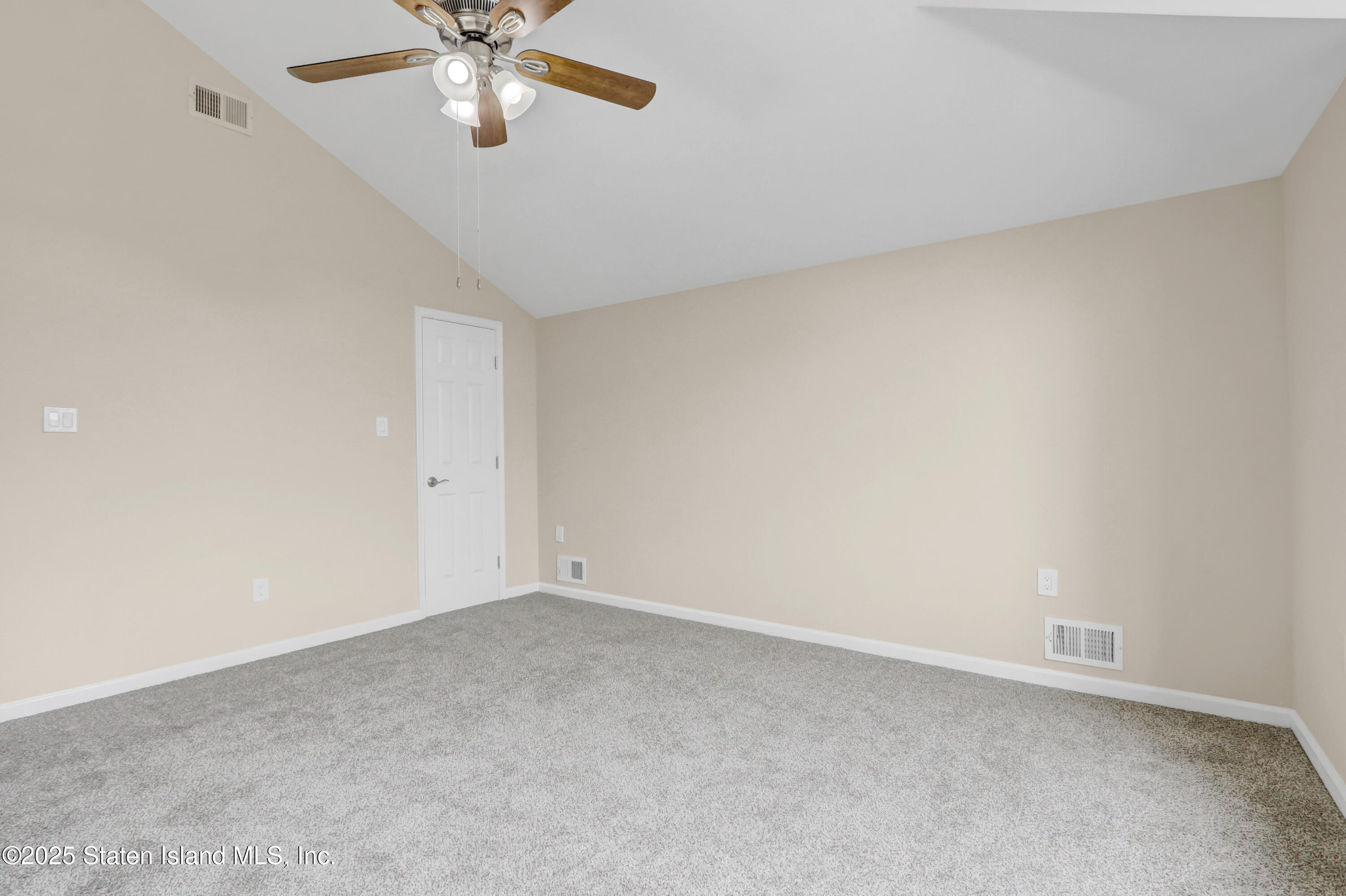 103 Savo Loop Staten Island, NY 10309 - Photo 27 of 46 a view of an empty room with a window