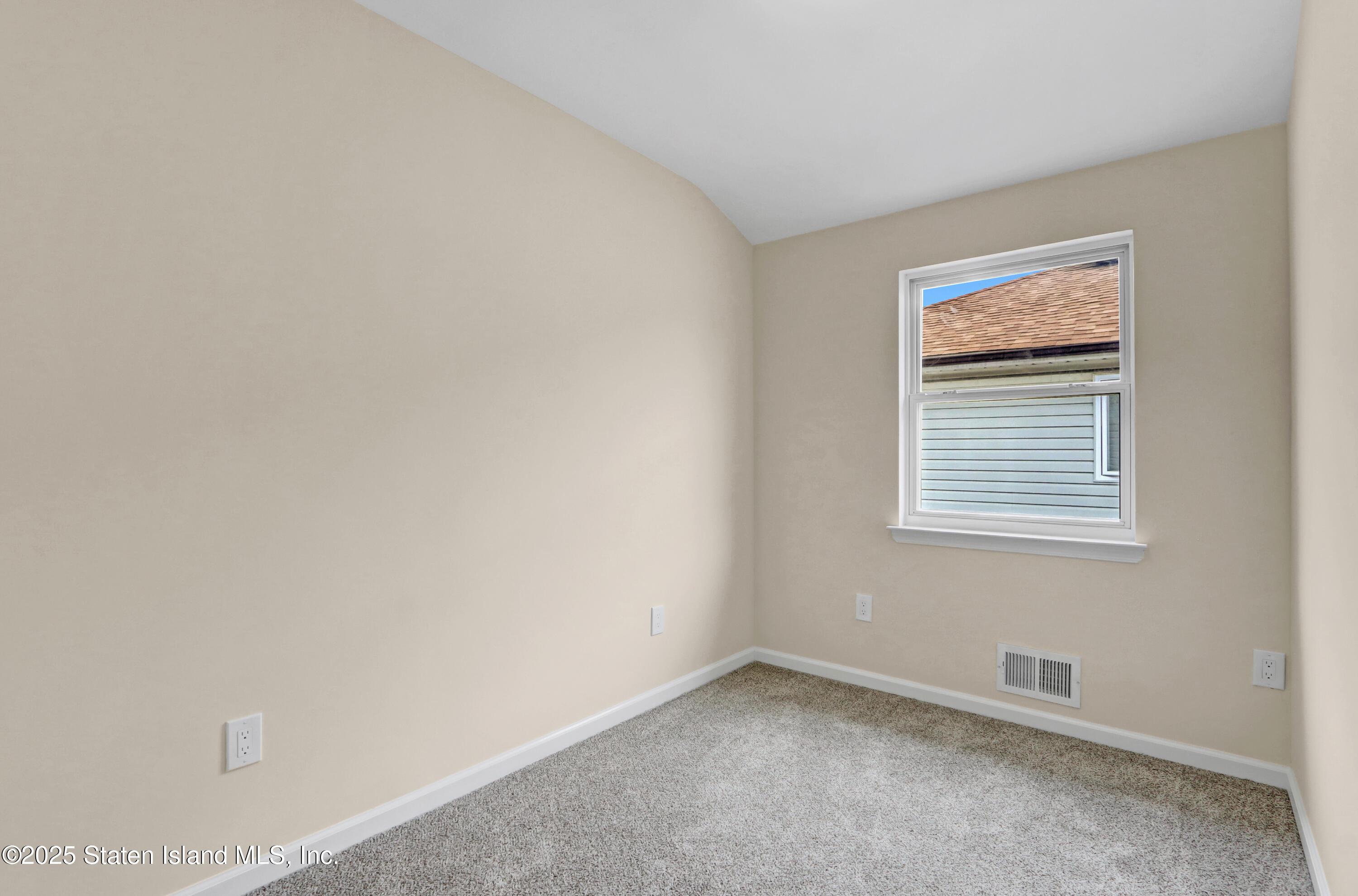 103 Savo Loop Staten Island, NY 10309 - Photo 31 of 46 a view of an empty room with a window