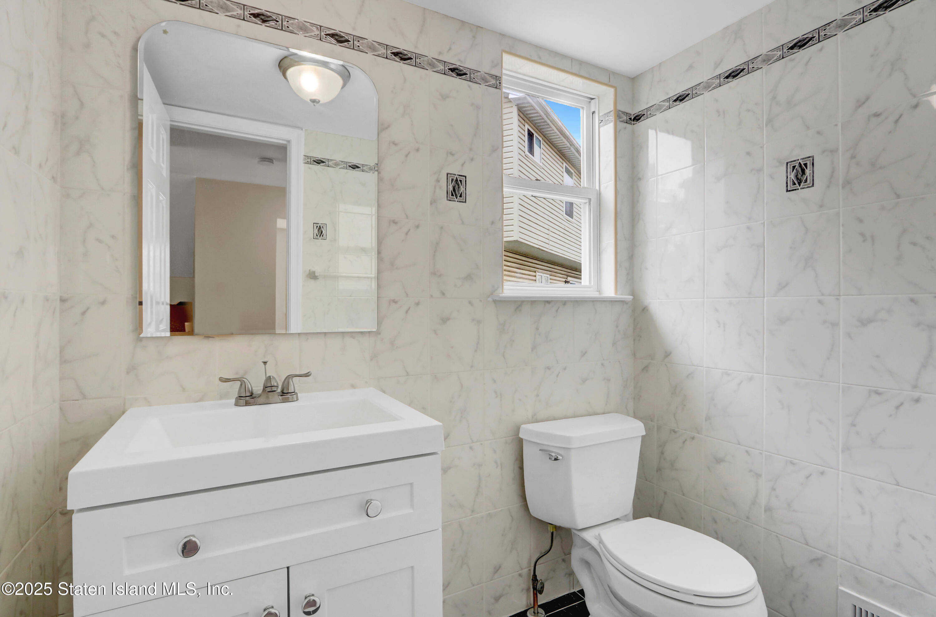 103 Savo Loop Staten Island, NY 10309 - Photo 8 of 46 a bathroom with a sink toilet and shower