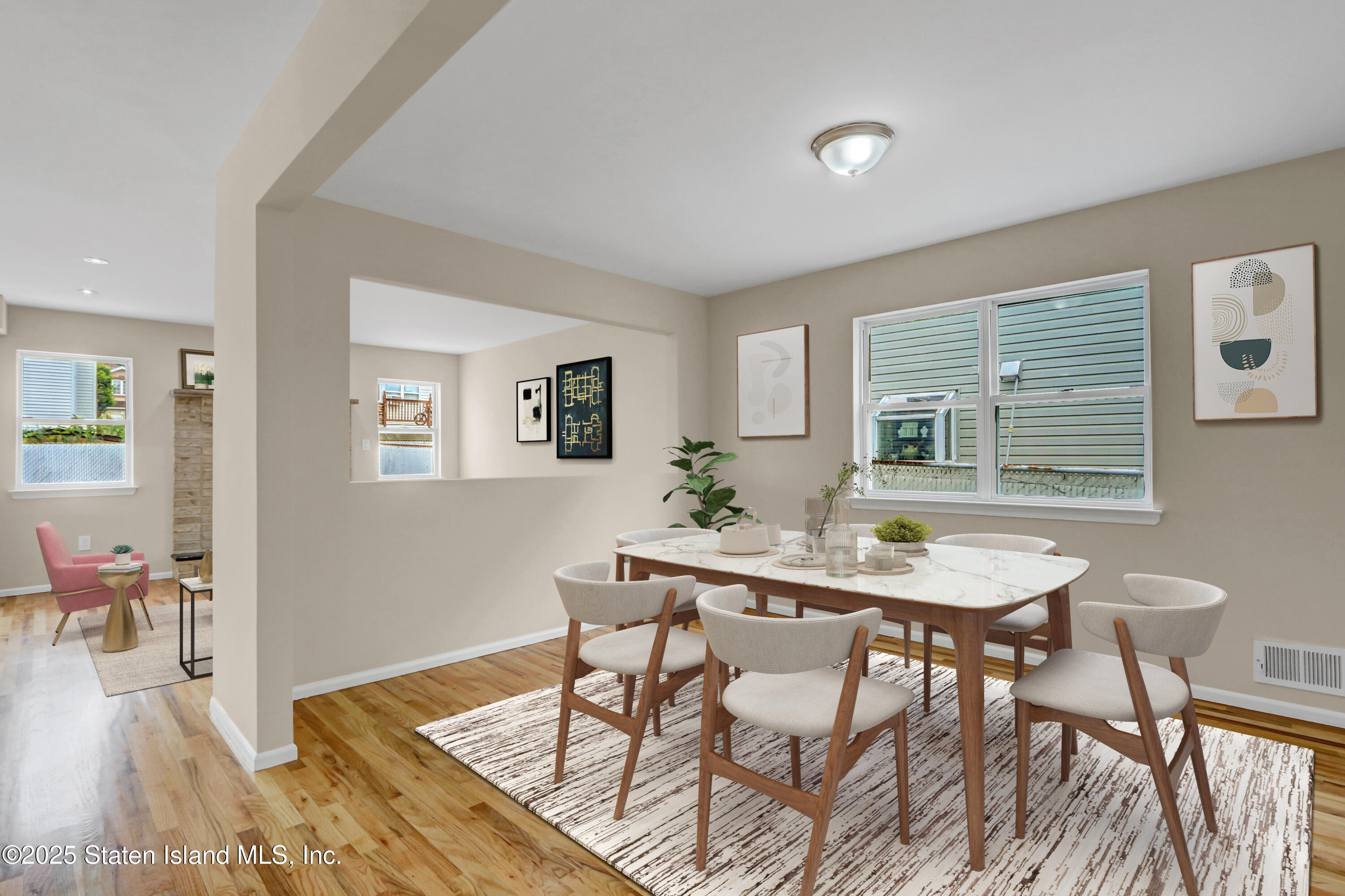 103 Savo Loop Staten Island, NY 10309 - Photo 9 of 46 a view of a dining room with furniture and wooden floor