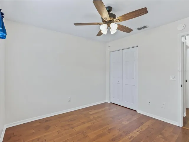 a view of an empty room with a bathroom