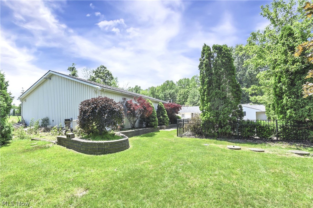 301 Crosse Road Amherst, OH 44001 - Photo 10 of 49 Expansive green lawn providing ample outdoor space