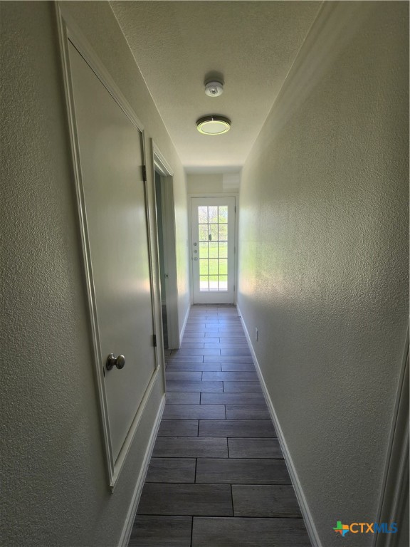 907 East 3rd Street, Unit B Lampasas, TX 76550 - Photo 8 of 19 a view of gallery with wooden floor