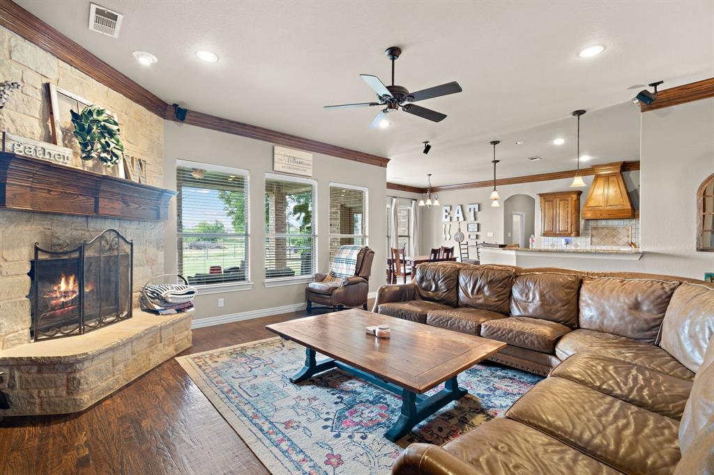 1341 Maxwell Road Haslet, TX 76052 - Photo 12 of 40 a living room with furniture and a fireplace