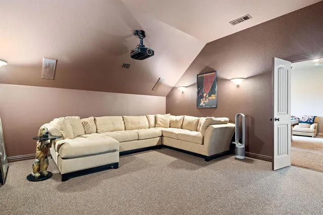 a room with furniture and a flat screen tv