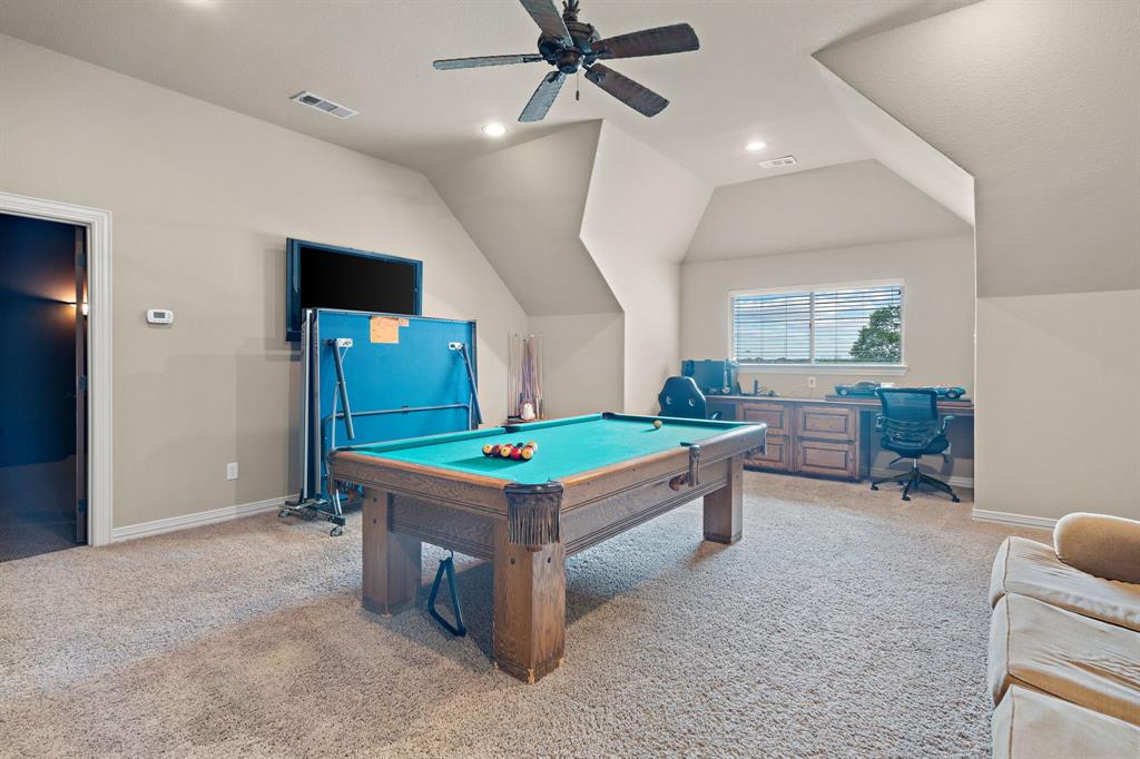 1341 Maxwell Road Haslet, TX 76052 - Photo 28 of 40 a room with furniture and a flat screen tv