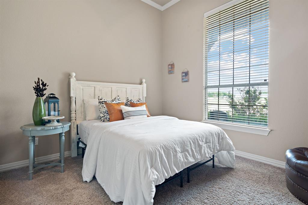 1341 Maxwell Road Haslet, TX 76052 - Photo 32 of 40 a bedroom with a bed and windows