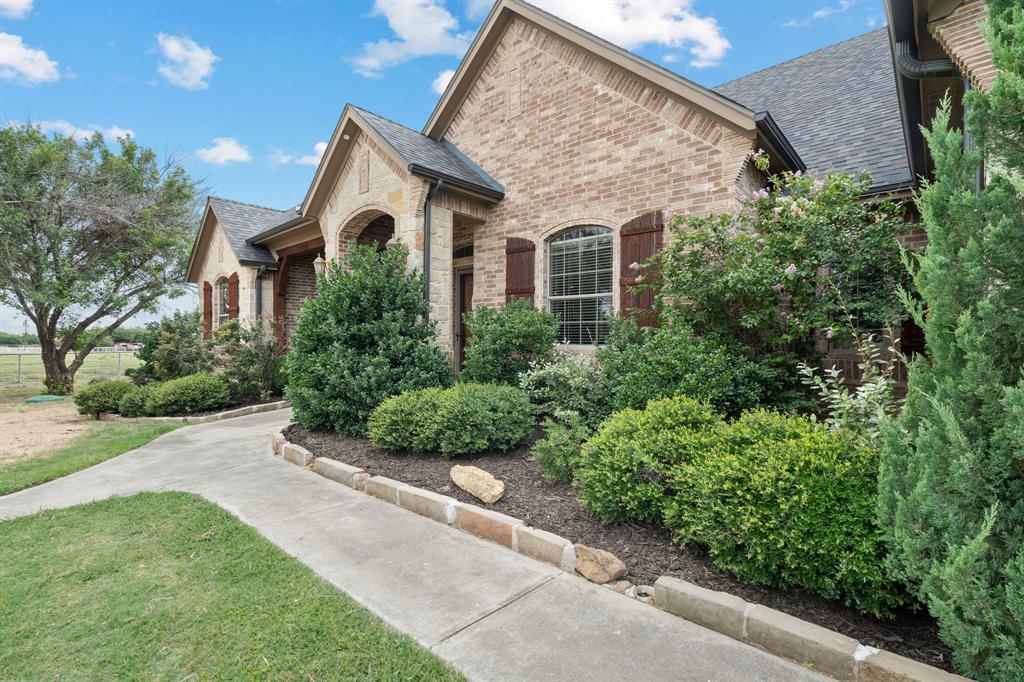 1341 Maxwell Road Haslet, TX 76052 - Photo 8 of 40 a front view of a house with a yard