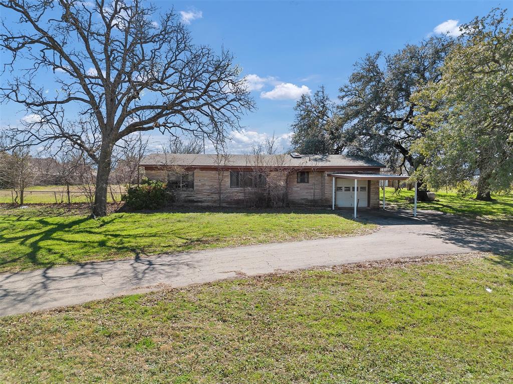 4201 Old Granbury Road Granbury, TX 76049 - Photo 13 of 14 a view of house with backyard and tree