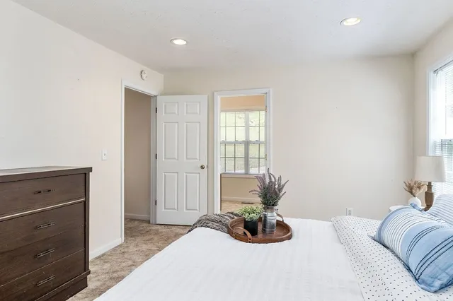 a bed room with a bed and a window