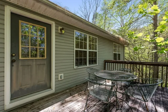 a view of a chair and table in the balcony