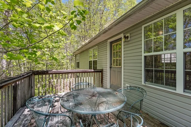 a view of a chair and table in the balcony