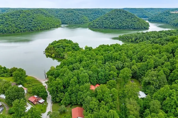 a view of a lake with a house in the background