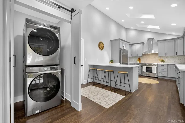 a view of a house with a wooden deck