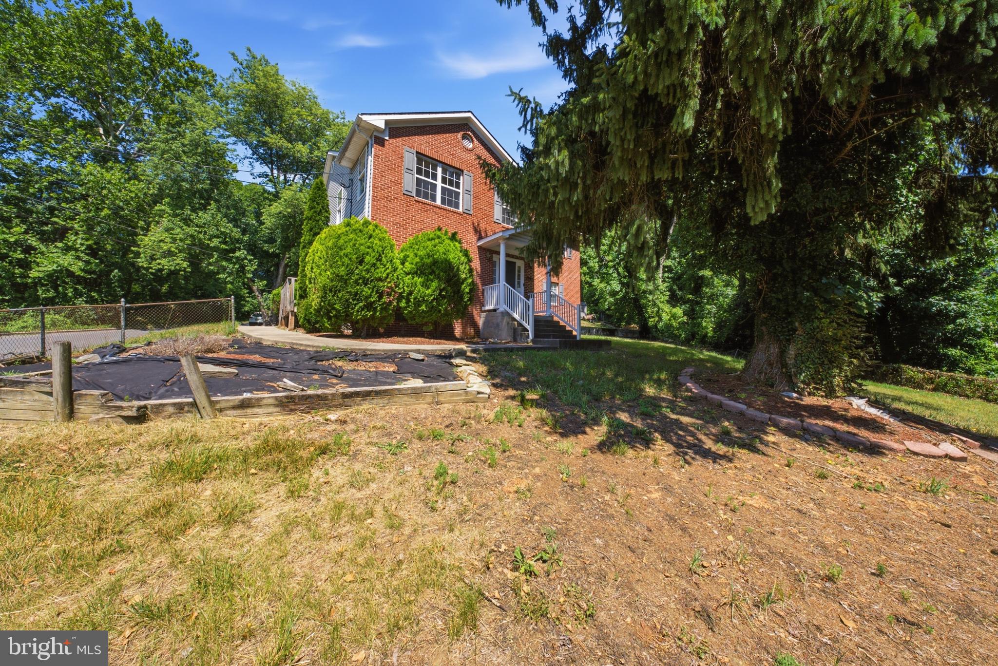 7611 Temple Hill Road Temple Hills, MD 20748 - Photo 24 of 25 a backyard of a house with yard and outdoor seating