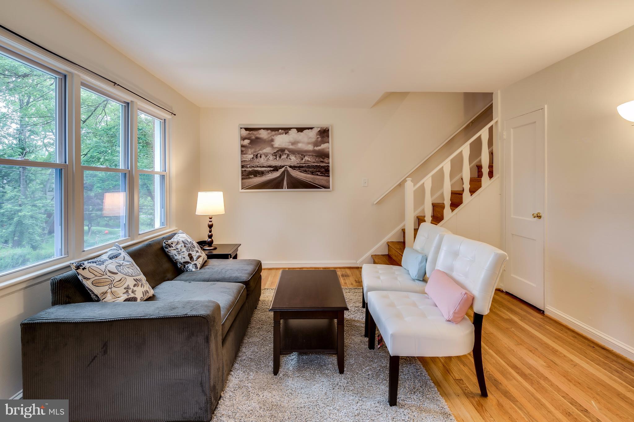 12025 Berry Street Silver Spring, MD 20902 - Photo 2 of 19 a living room with furniture and a window