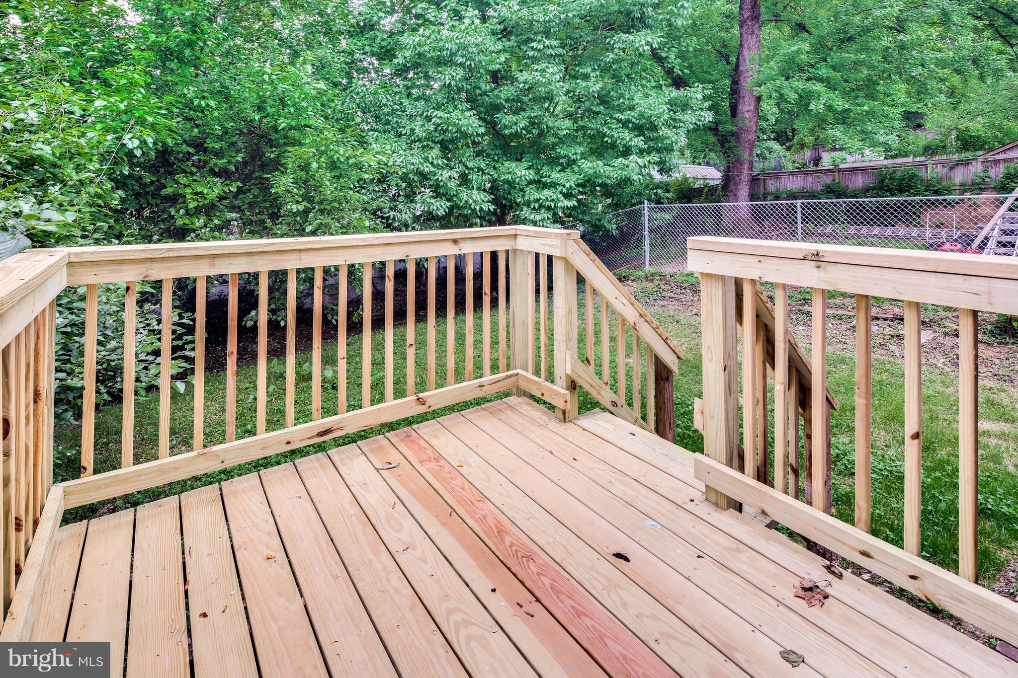 12025 Berry Street Silver Spring, MD 20902 - Photo 16 of 19 a view of balcony with deck and wooden floor