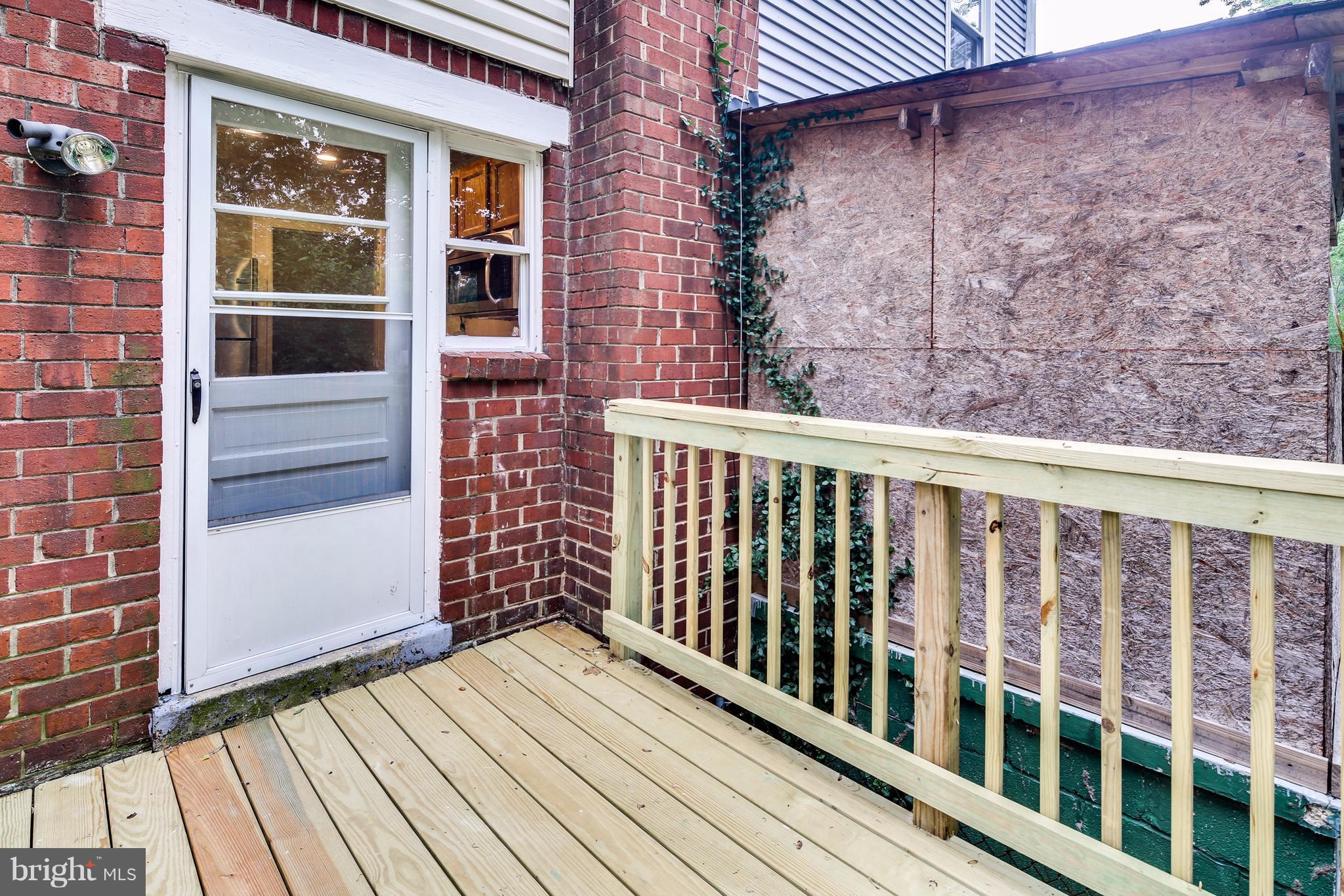 12025 Berry Street Silver Spring, MD 20902 - Photo 17 of 19 a view of wooden balcony