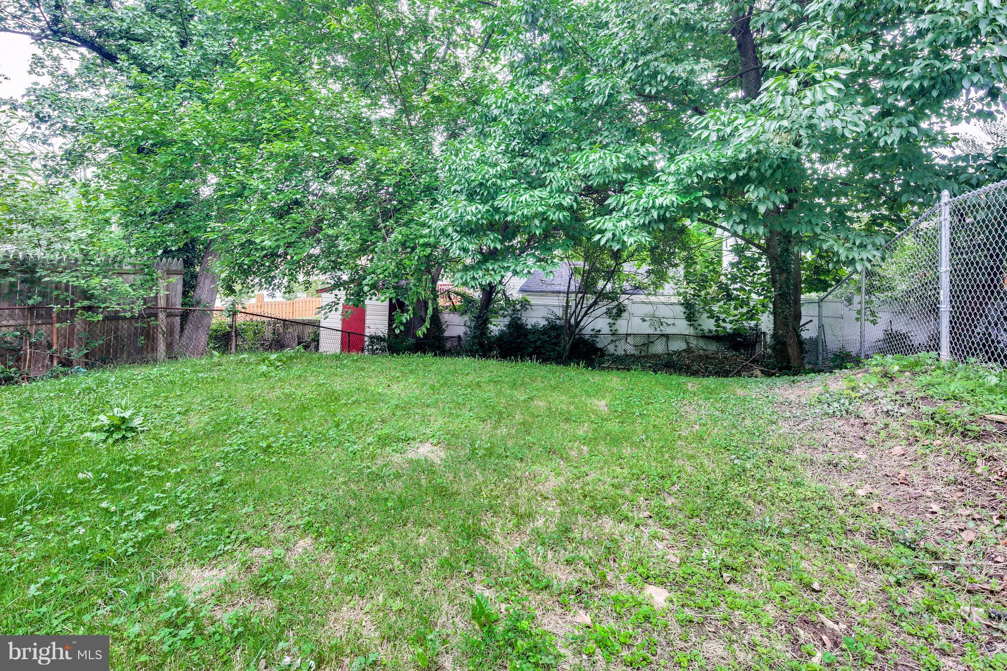 12025 Berry Street Silver Spring, MD 20902 - Photo 18 of 19 a view of a backyard with a small cabin