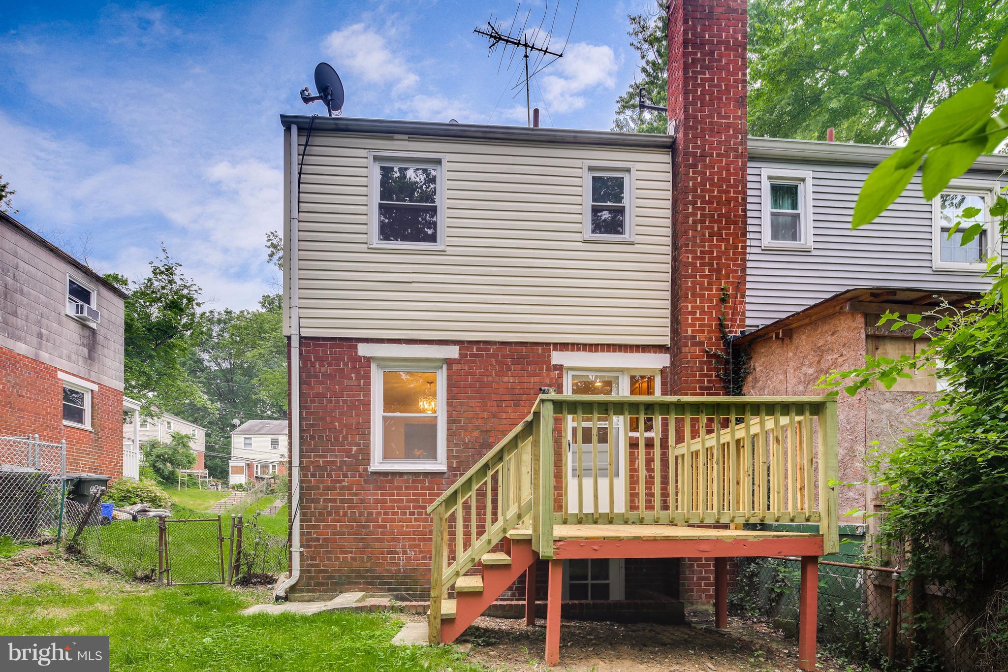12025 Berry Street Silver Spring, MD 20902 - Photo 19 of 19 a view of a house with a yard and furniture