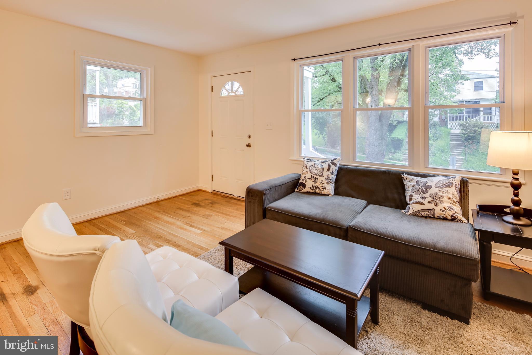 12025 Berry Street Silver Spring, MD 20902 - Photo 3 of 19 a living room with furniture and a window