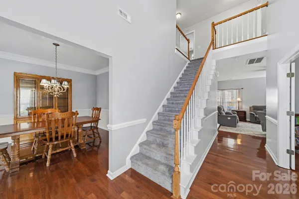 a view of a livingroom with furniture and hardwood floor