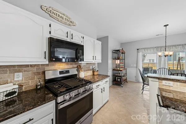 a kitchen with a stove and a sink