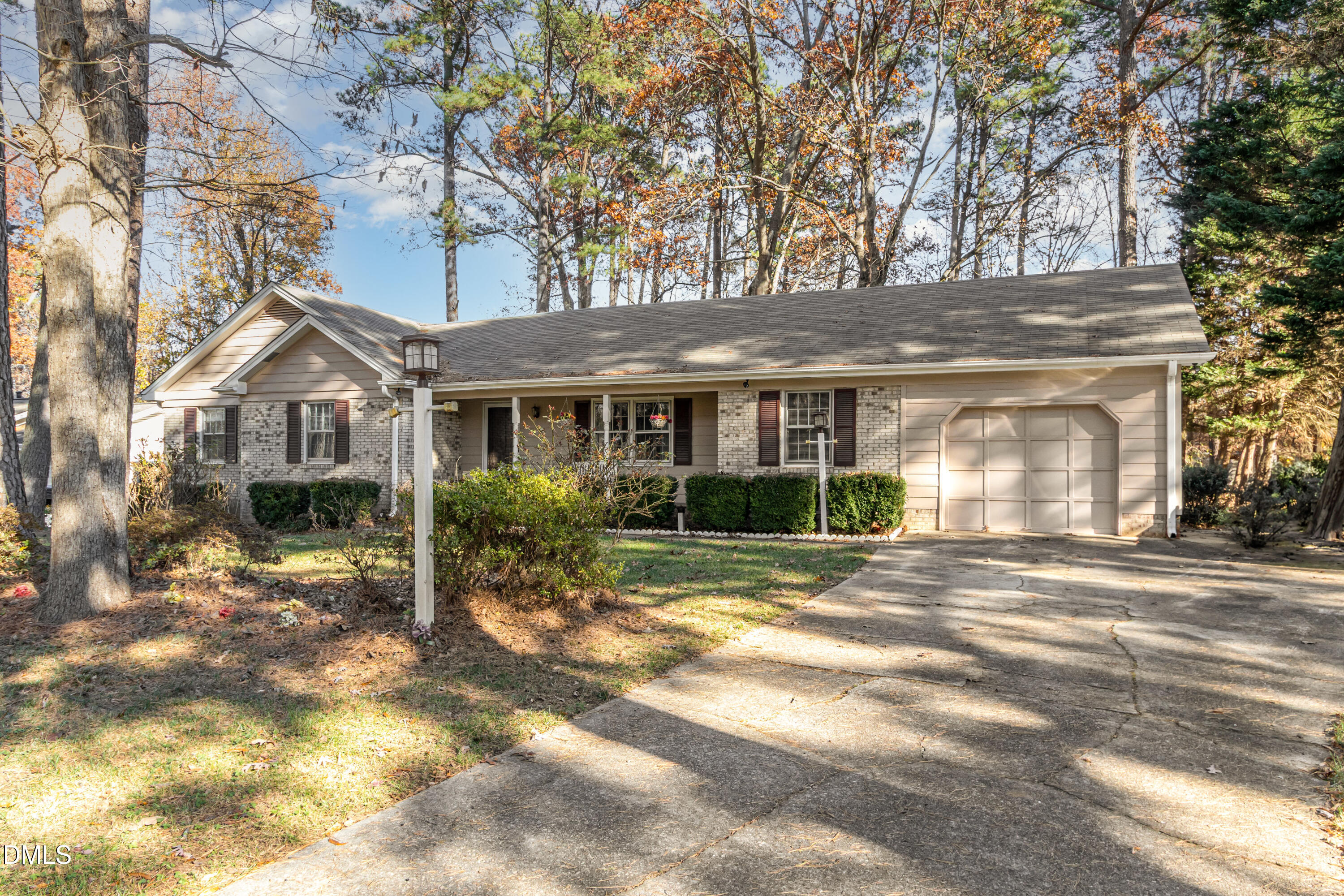 6800 Valley Drive Raleigh, NC 27612 - Photo 2 of 35 a front view of a house with a garden