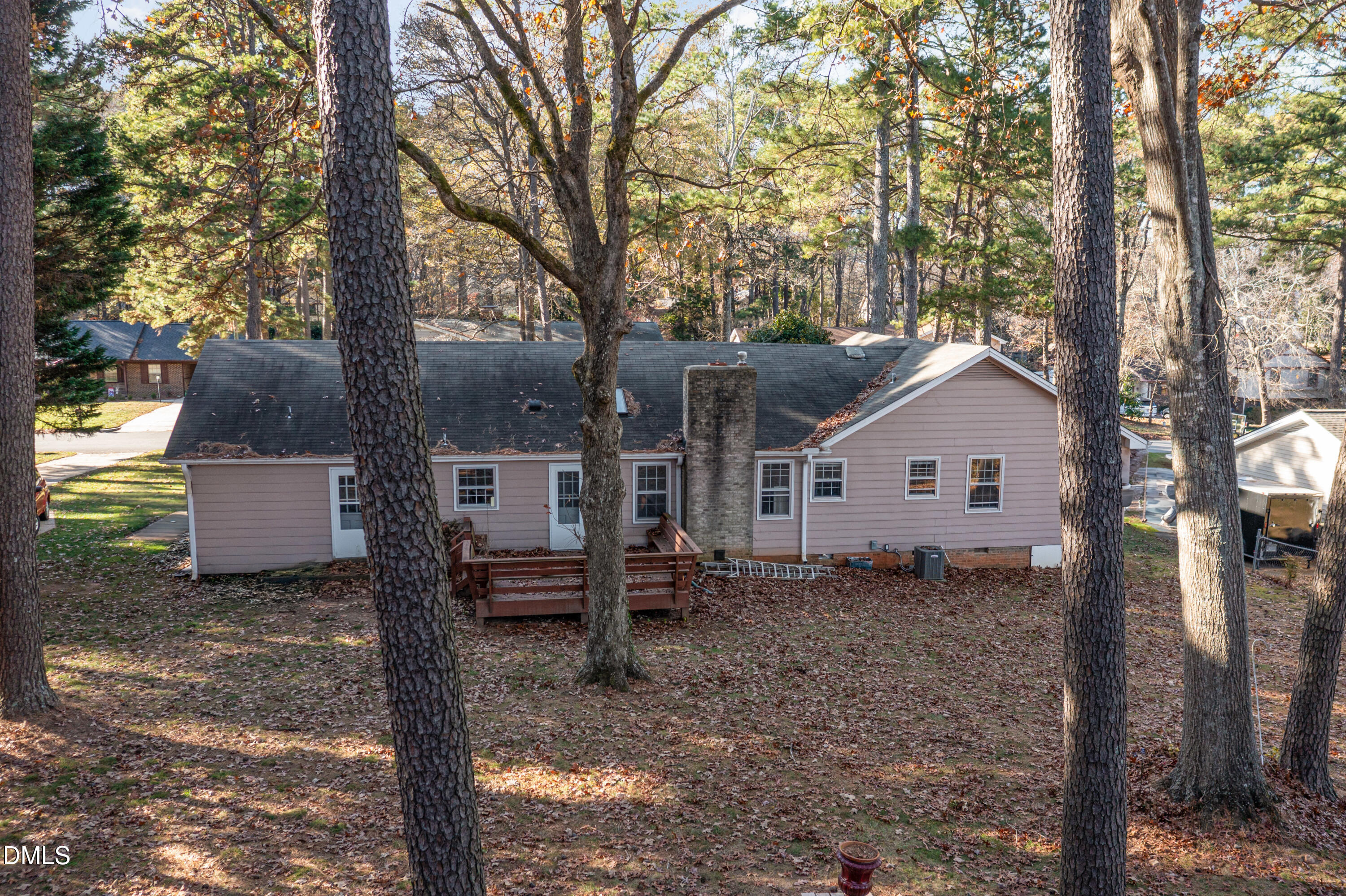 6800 Valley Drive Raleigh, NC 27612 - Photo 30 of 35 a view of a house with a yard and large tree