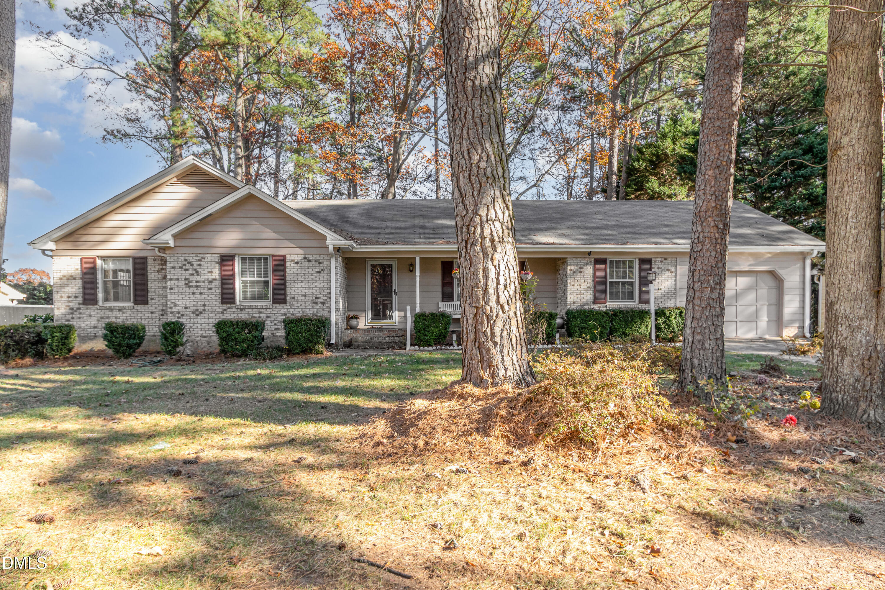 6800 Valley Drive Raleigh, NC 27612 - Photo 3 of 35 a front view of a house with a garden