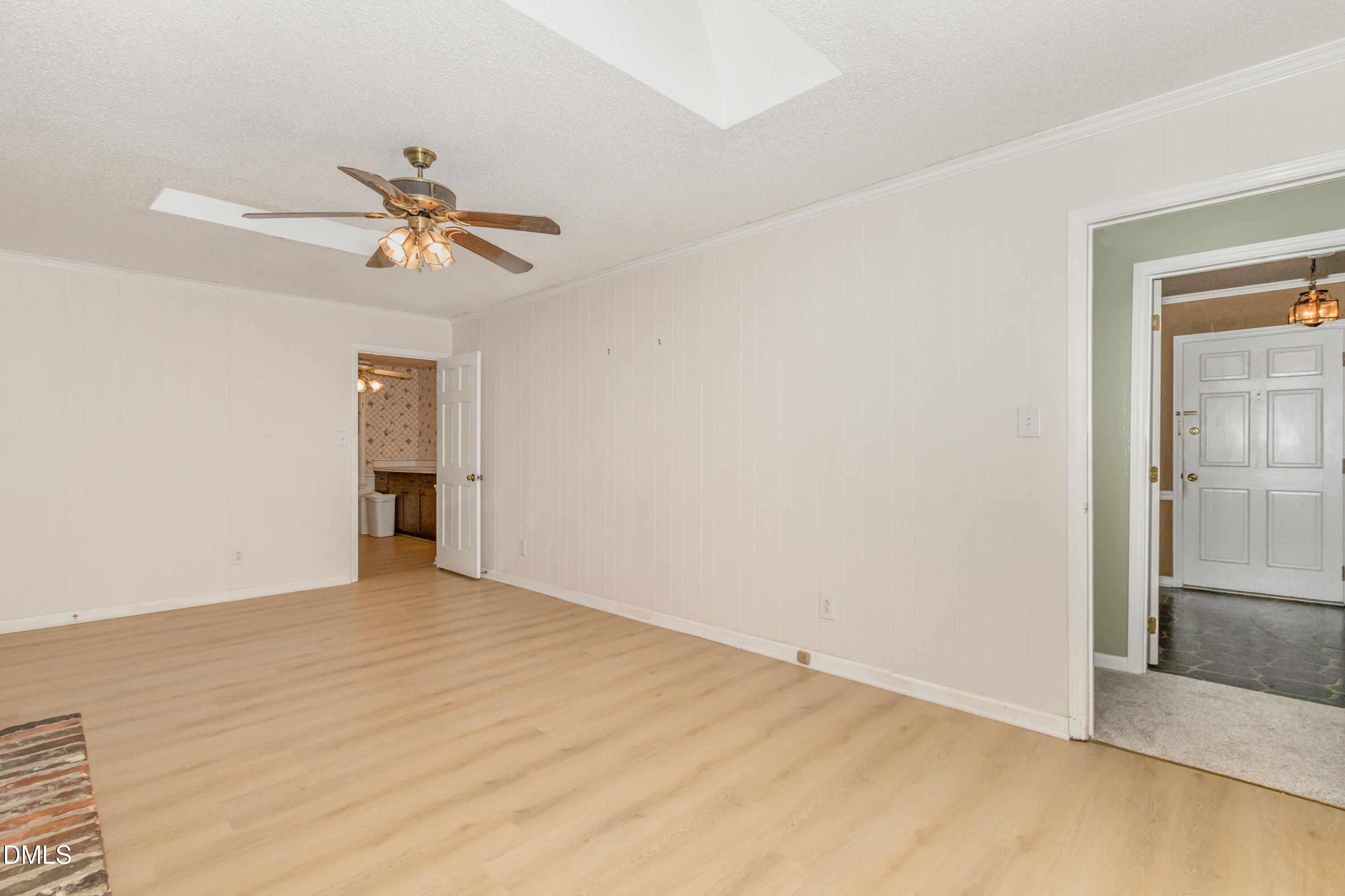 6800 Valley Drive Raleigh, NC 27612 - Photo 8 of 35 a view of empty room with wooden floor and ceiling fan