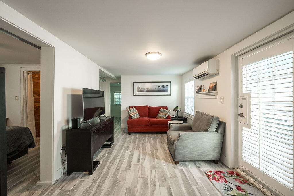 409 Margaret Street, Unit 202 Key West, FL 33040 - Photo 21 of 23 a living room with furniture and a flat screen tv
