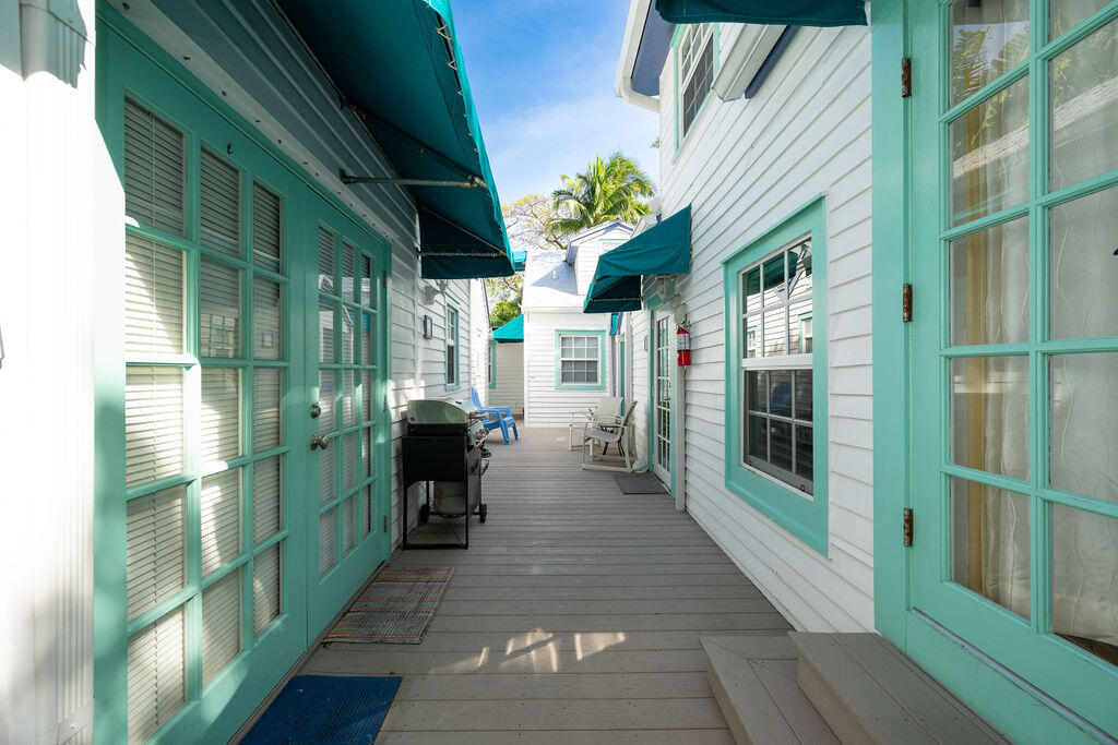 409 Margaret Street, Unit 202 Key West, FL 33040 - Photo 23 of 23 a front view of a house with a potted plant