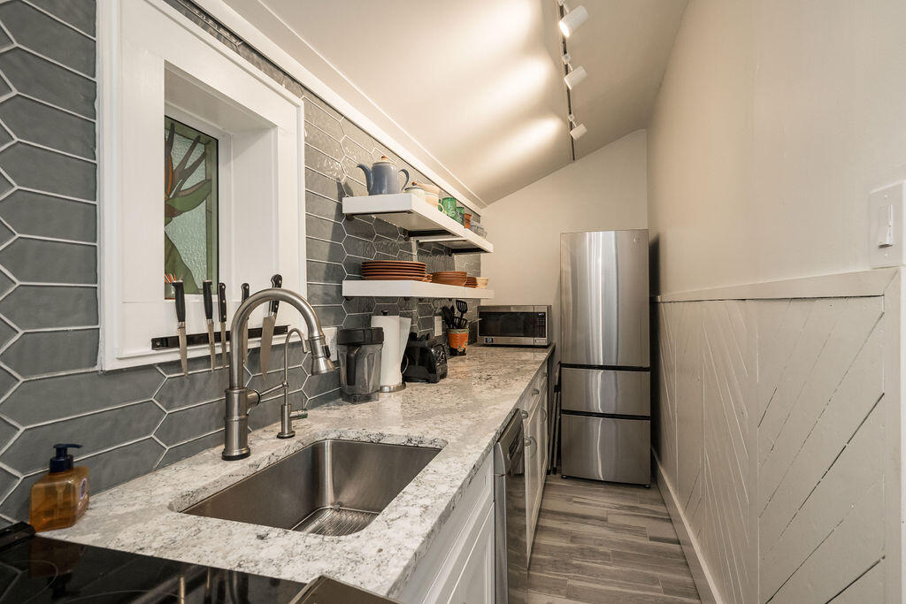 409 Margaret Street, Unit 202 Key West, FL 33040 - Photo 7 of 23 a kitchen with refrigerator and countertop