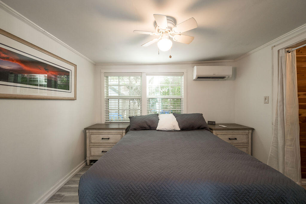 409 Margaret Street, Unit 202 Key West, FL 33040 - Photo 9 of 23 a bedroom with a bed and a window