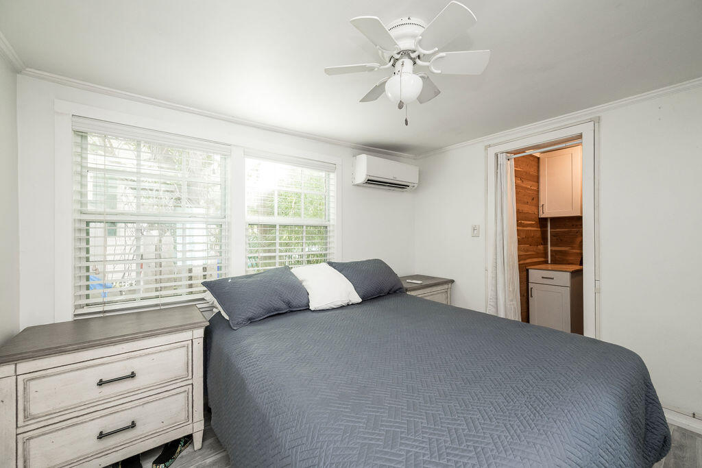 409 Margaret Street, Unit 202 Key West, FL 33040 - Photo 10 of 23 a bedroom with a large bed and a window
