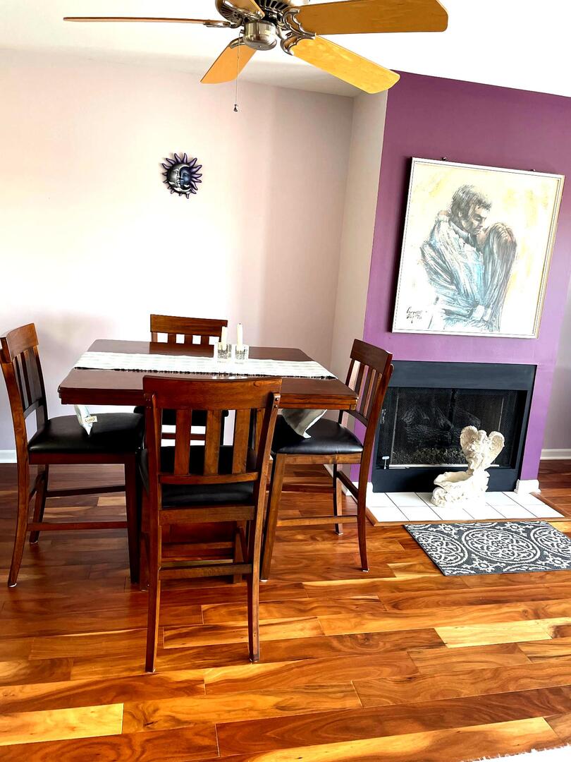 362 Kelburn Road, Unit 324 Deerfield, IL 60015 - Photo 3 of 11 a view of a dining room with furniture a rug and wooden floor