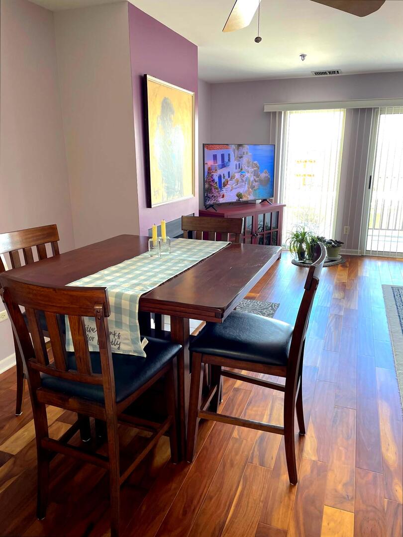 362 Kelburn Road, Unit 324 Deerfield, IL 60015 - Photo 4 of 11 a view of a dining room with furniture window and wooden floor
