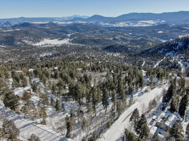 a view of a city with mountains in the background