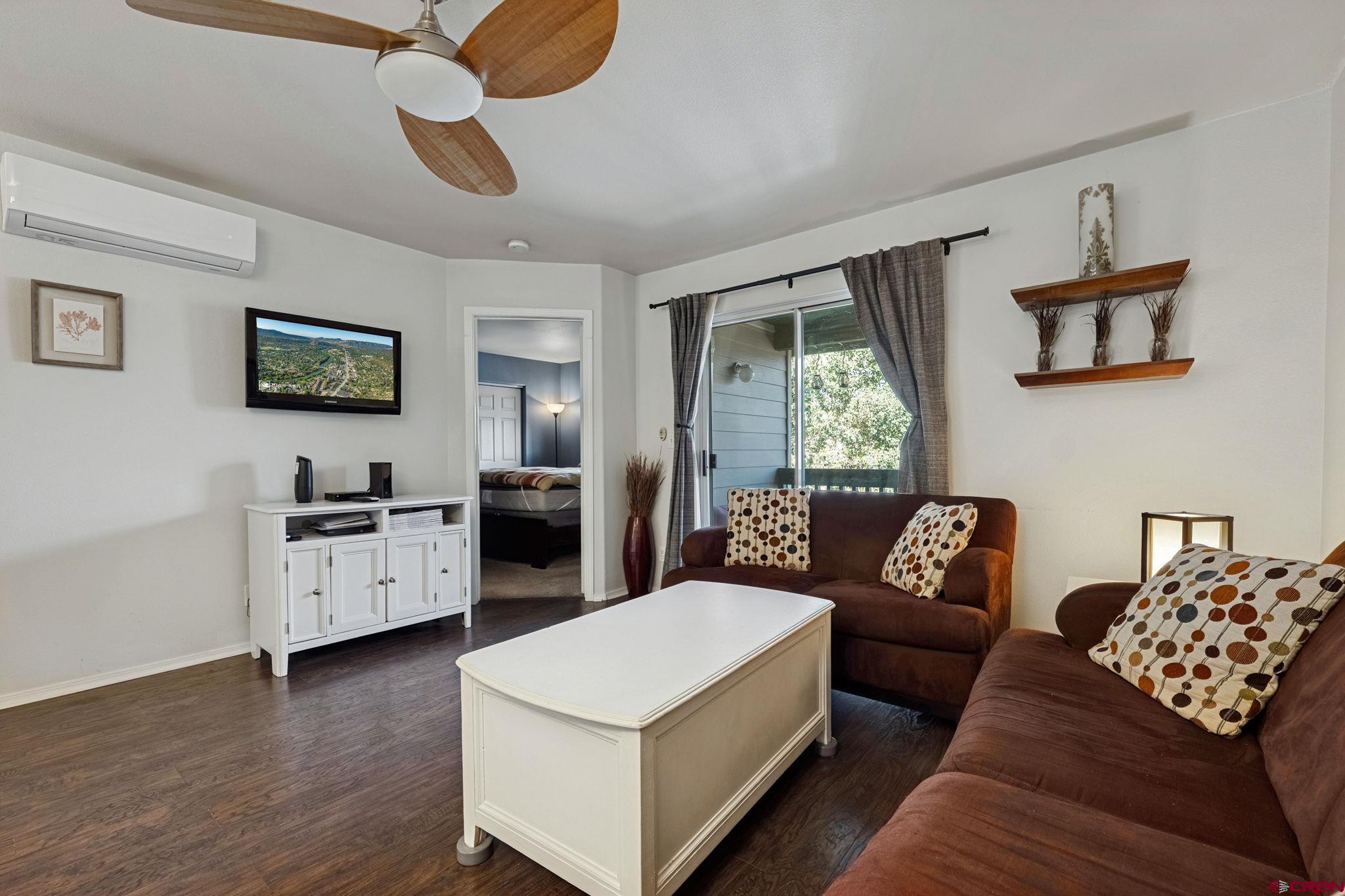 1100 Goeglein Gulch Road, Unit 225 Durango, CO 81301 - Photo 19 of 44 a living room with furniture and a large window