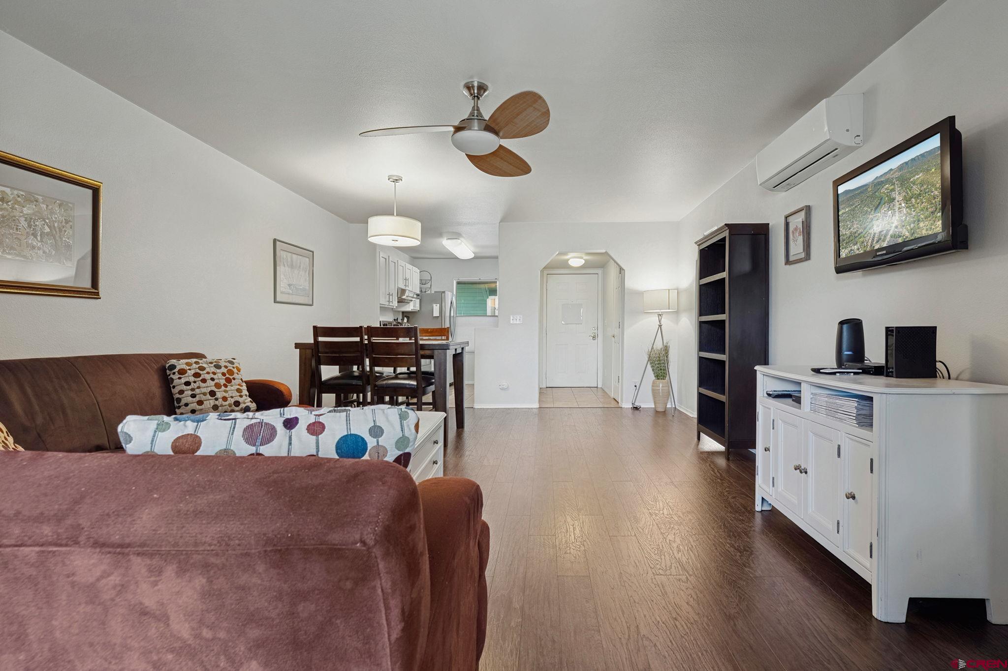 1100 Goeglein Gulch Road, Unit 225 Durango, CO 81301 - Photo 21 of 44 a living room with furniture and kitchen view