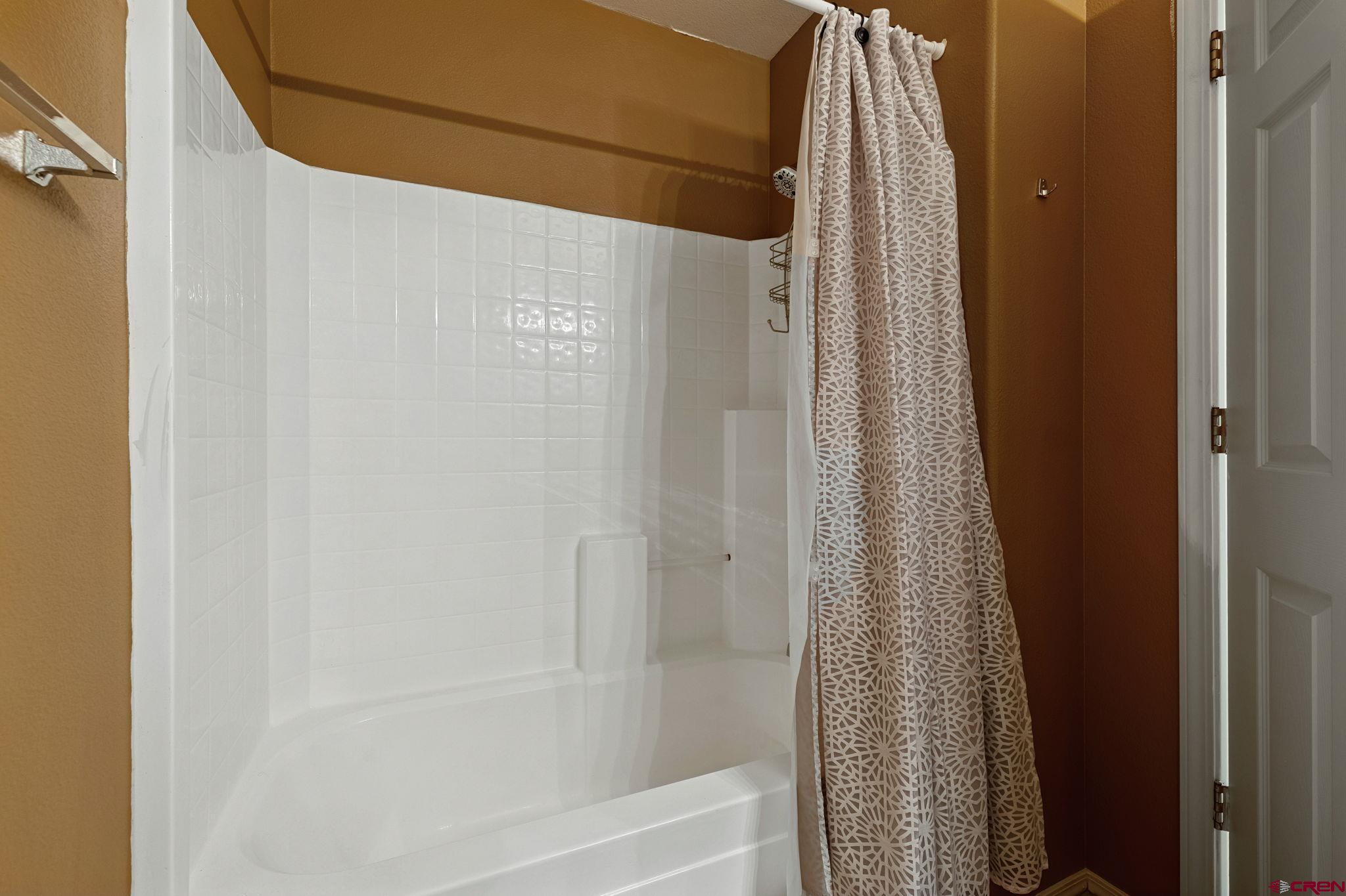 1100 Goeglein Gulch Road, Unit 225 Durango, CO 81301 - Photo 32 of 44 a bathroom with a shower and a tub