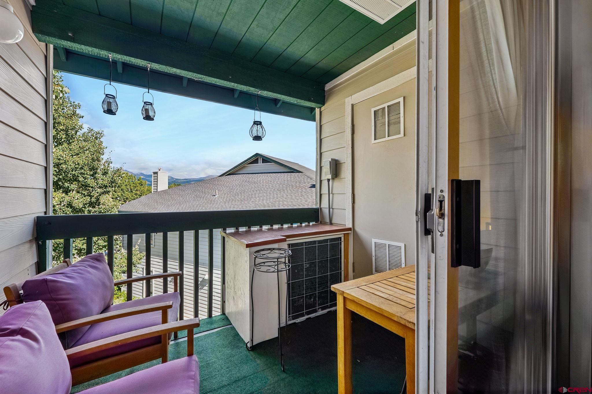 1100 Goeglein Gulch Road, Unit 225 Durango, CO 81301 - Photo 8 of 44 a balcony with furniture and a potted plant