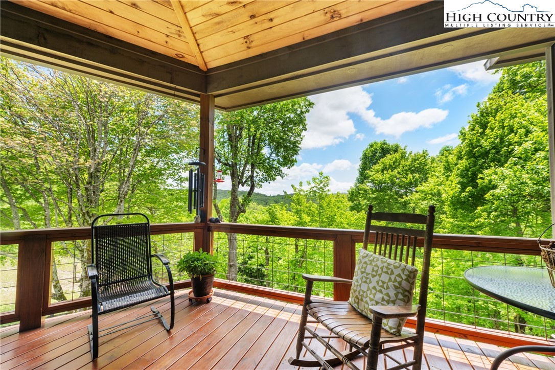 114 Preakness Boone, NC 28607 - Photo 17 of 49 a view of a porch with furniture and wooden floor