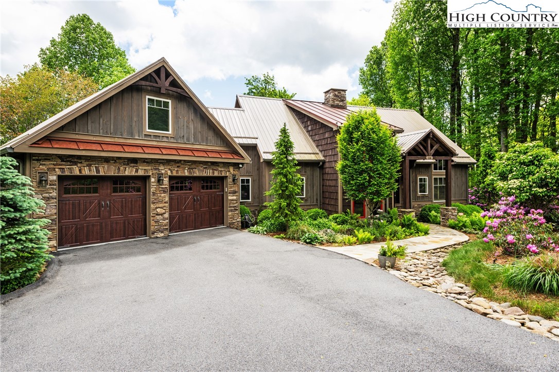 114 Preakness Boone, NC 28607 - Photo 2 of 49 a front view of a house with a yard and garage