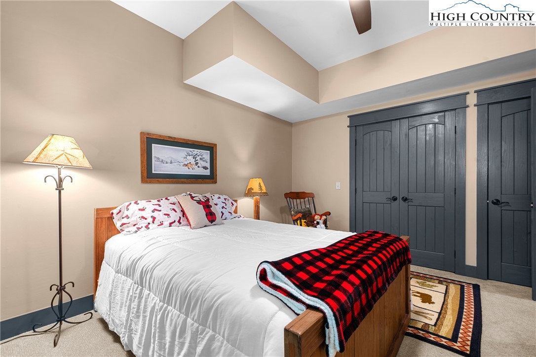 114 Preakness Boone, NC 28607 - Photo 33 of 49 a bedroom with a bed and a lamp