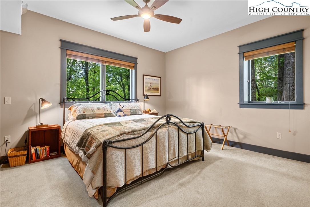 114 Preakness Boone, NC 28607 - Photo 39 of 49 a bed sitting in a bedroom next to a window