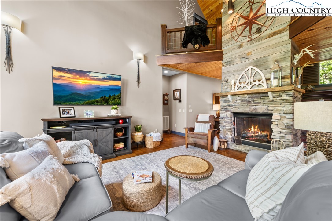 114 Preakness Boone, NC 28607 - Photo 6 of 49 a living room with furniture a fireplace and a flat screen tv