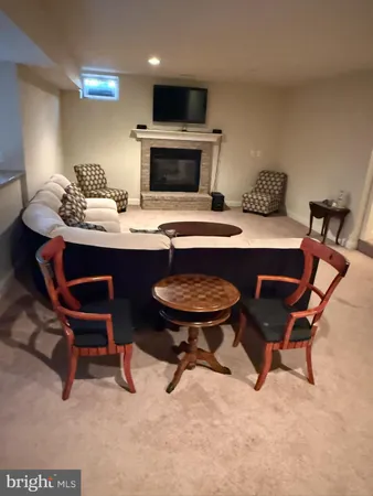 a room with a table chairs and entryway