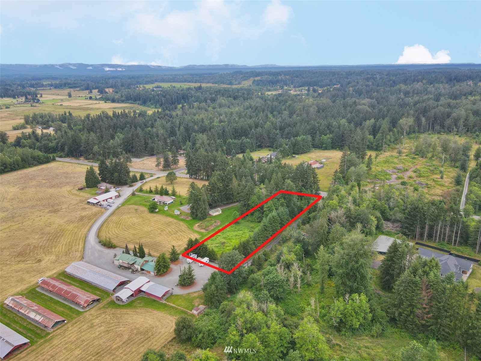 10312 272nd Street East Graham, WA 98338 - Photo 15 of 27 an aerial view of a house with a garden and lake view